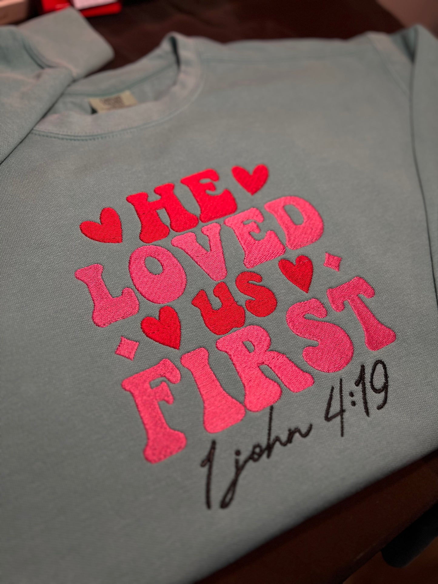 He Loved Us First embroidered sweatshirt
